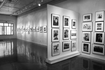 Photo gallery with white walls and black and white photography 
