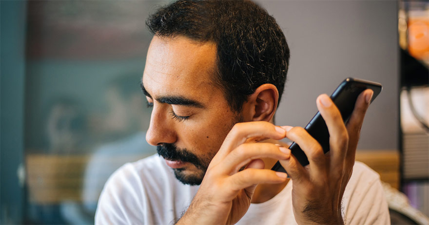 Man using screen reader software on phone