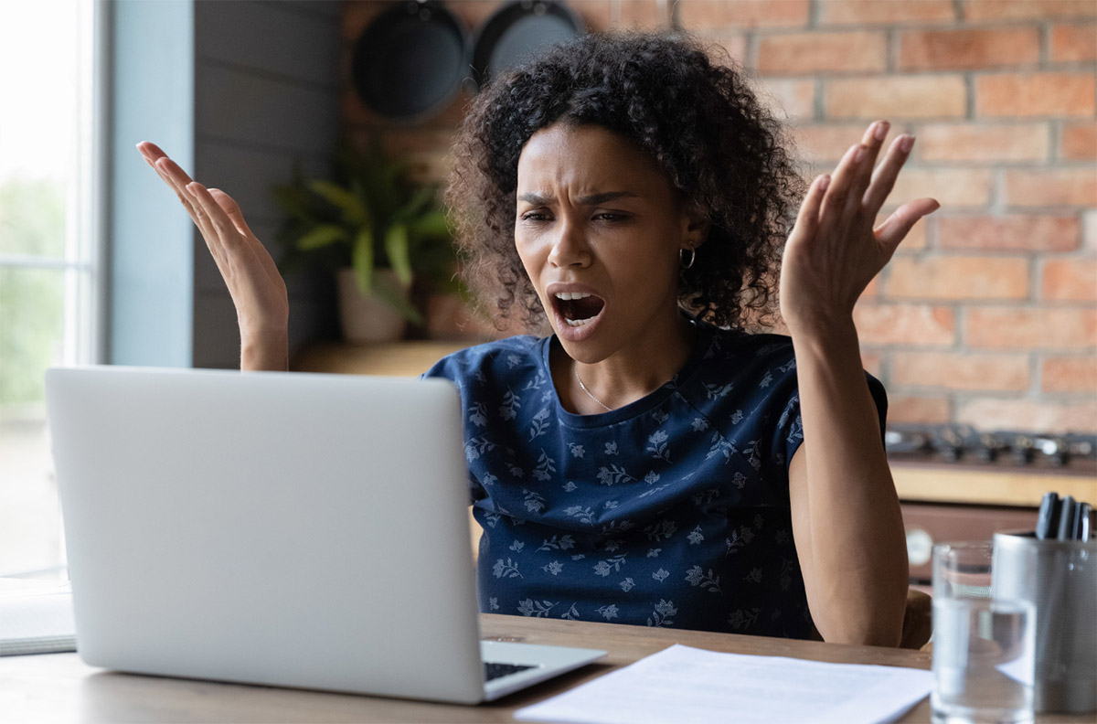 Office worker frustrated with laptop